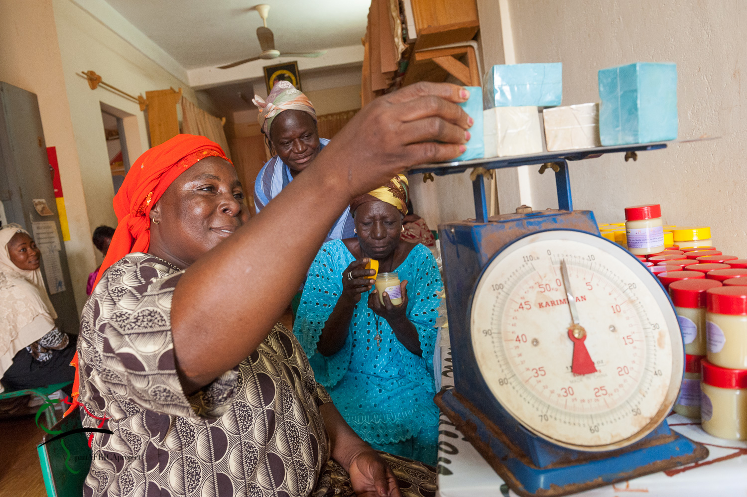 Woman weighing cosmetics on a scale
