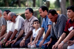 Men kneeling for prayer in Alexandria Egypt
