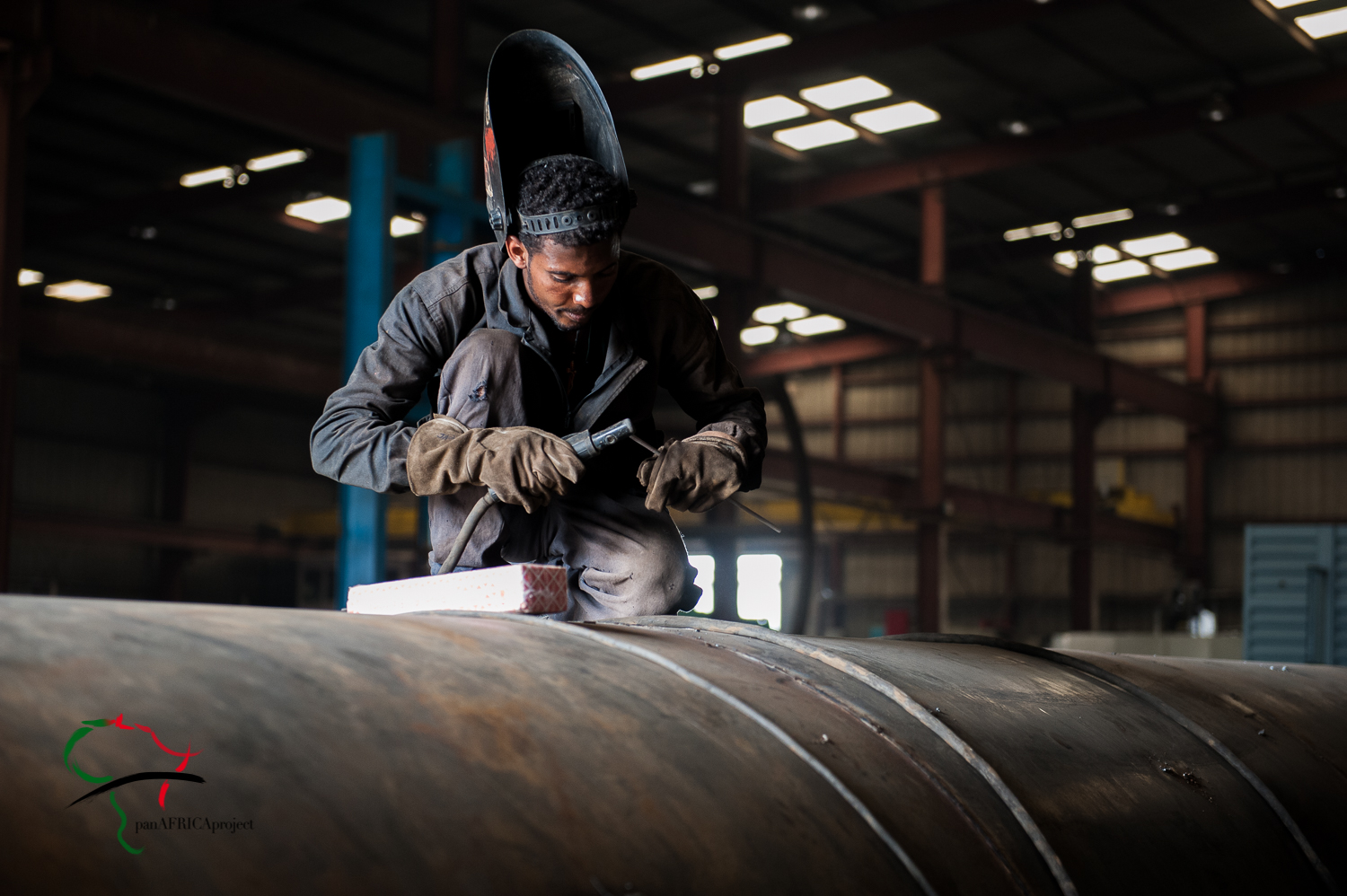 Factory worker welding metal