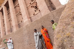 Children standing outside of rock-hewn church