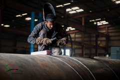 Factory worker welding metal