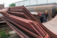 Female industrial workers examining iron