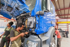 Workers repairing a truck