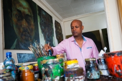 Painter working in his studio
