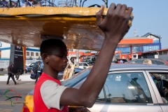 Sunglasses vendor walking on the street in Accra, Ghana