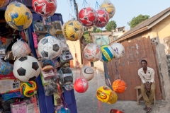 Street vendor selling athletic balls in Cape Coast, Ghana