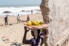 Child holding food her head in Winneba, Ghana