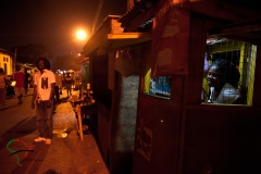 People at a market during the night time in Accra, Ghana