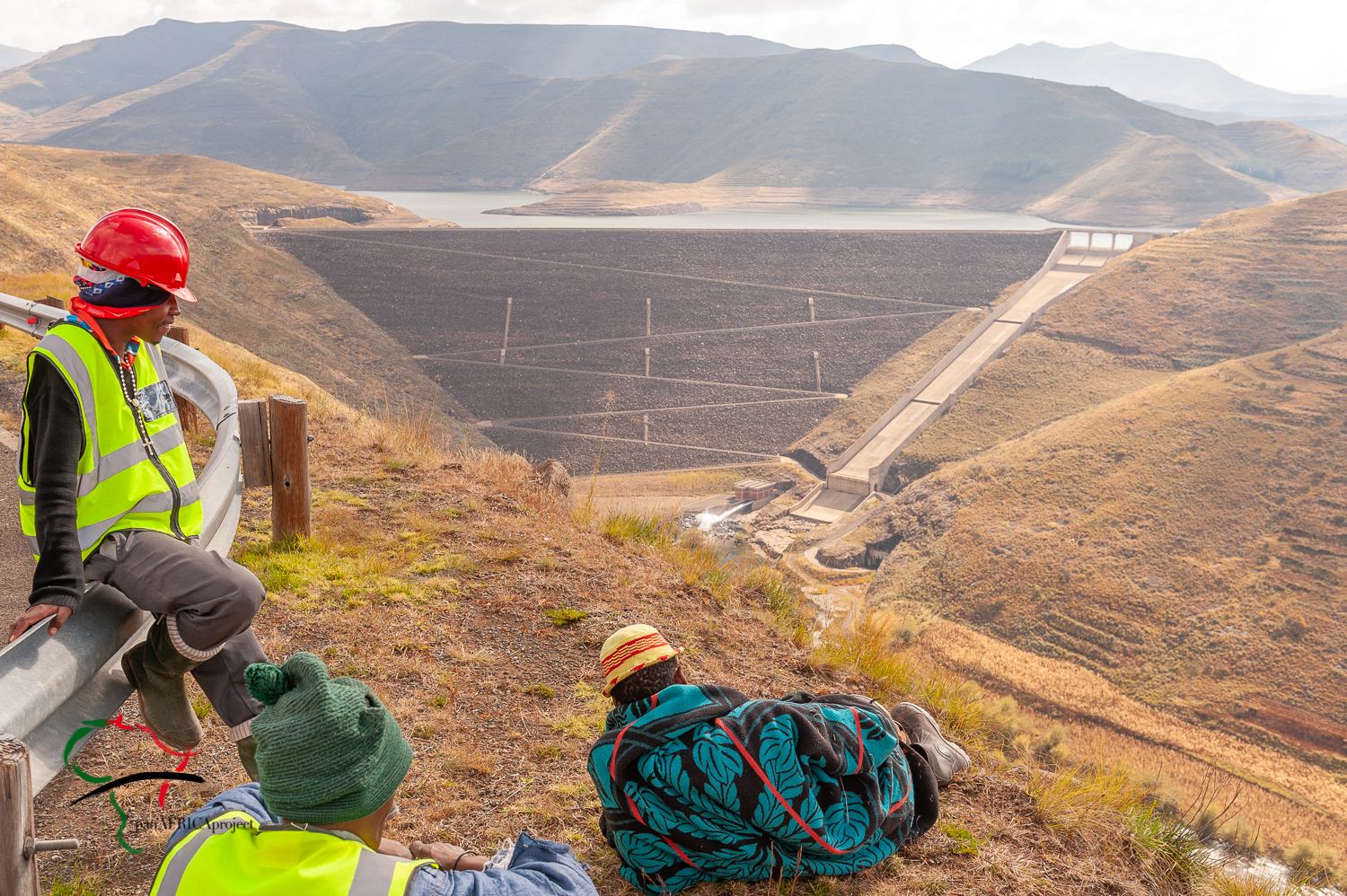 Workers relaxing while overlooking the Mohale Dam