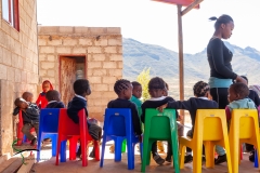 School children sitting down outside
