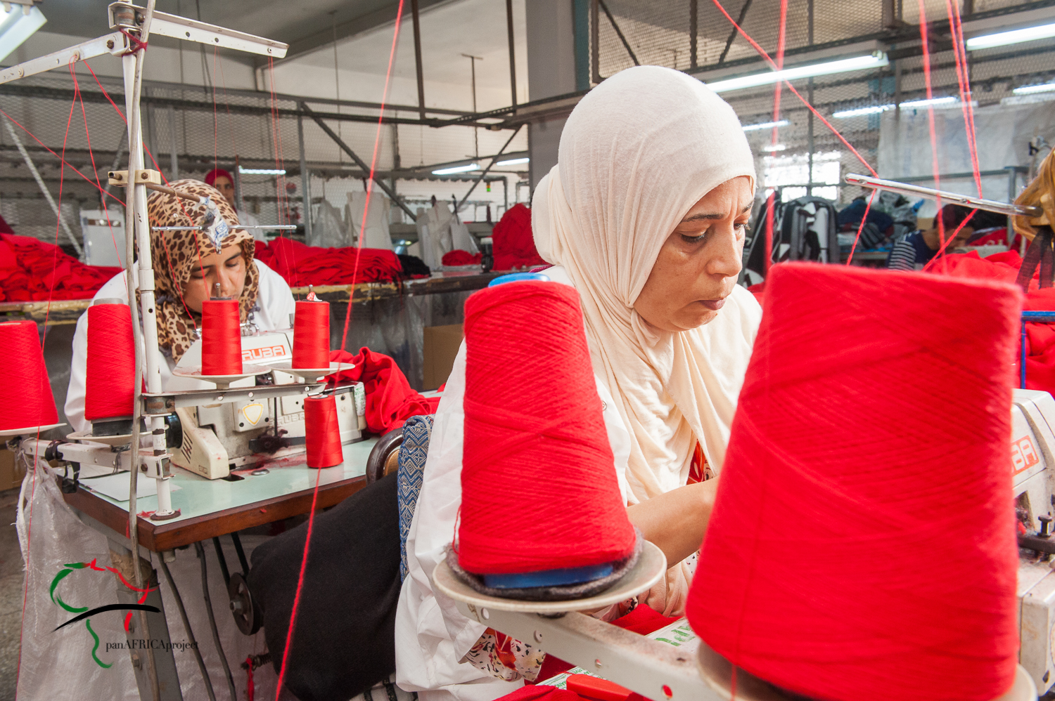 Women using sewing machines to make clothes