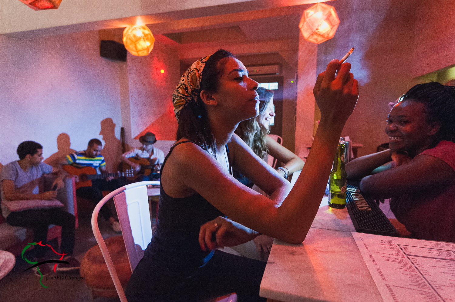 Woman smoking a cigarette in a restaurant