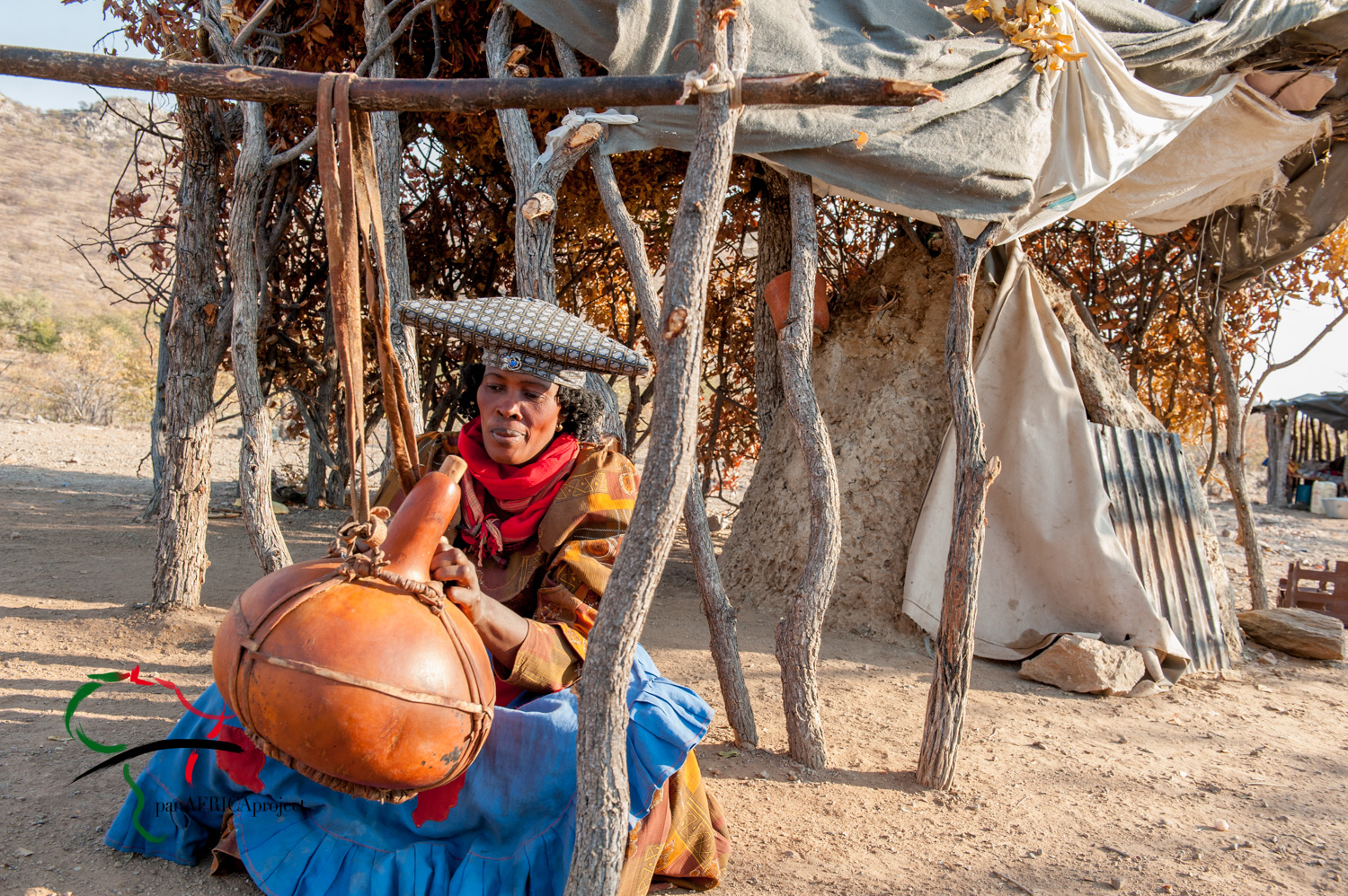 Woman from Herero Tribe churning butter.