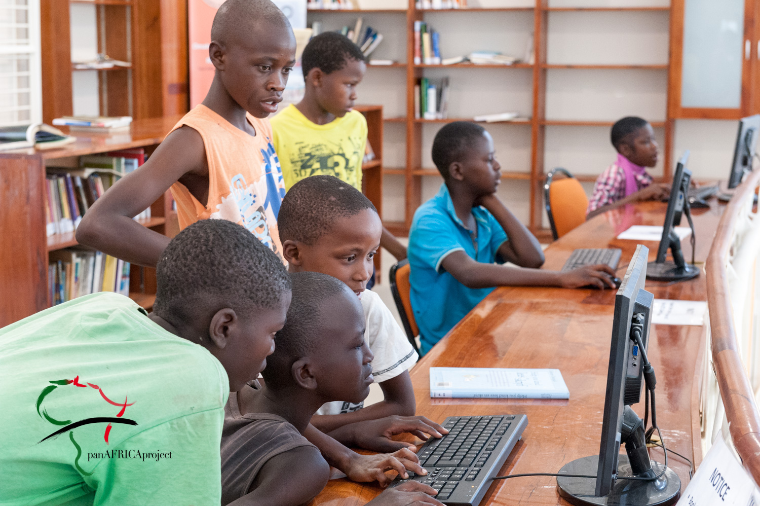 Children working on computers in the library