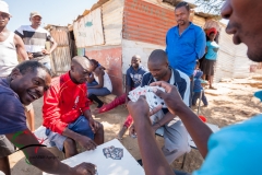 Men playing a card game.