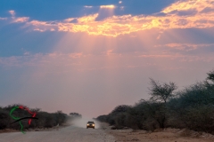 Car driving through the desert