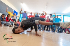 Student break dancing during theater class
