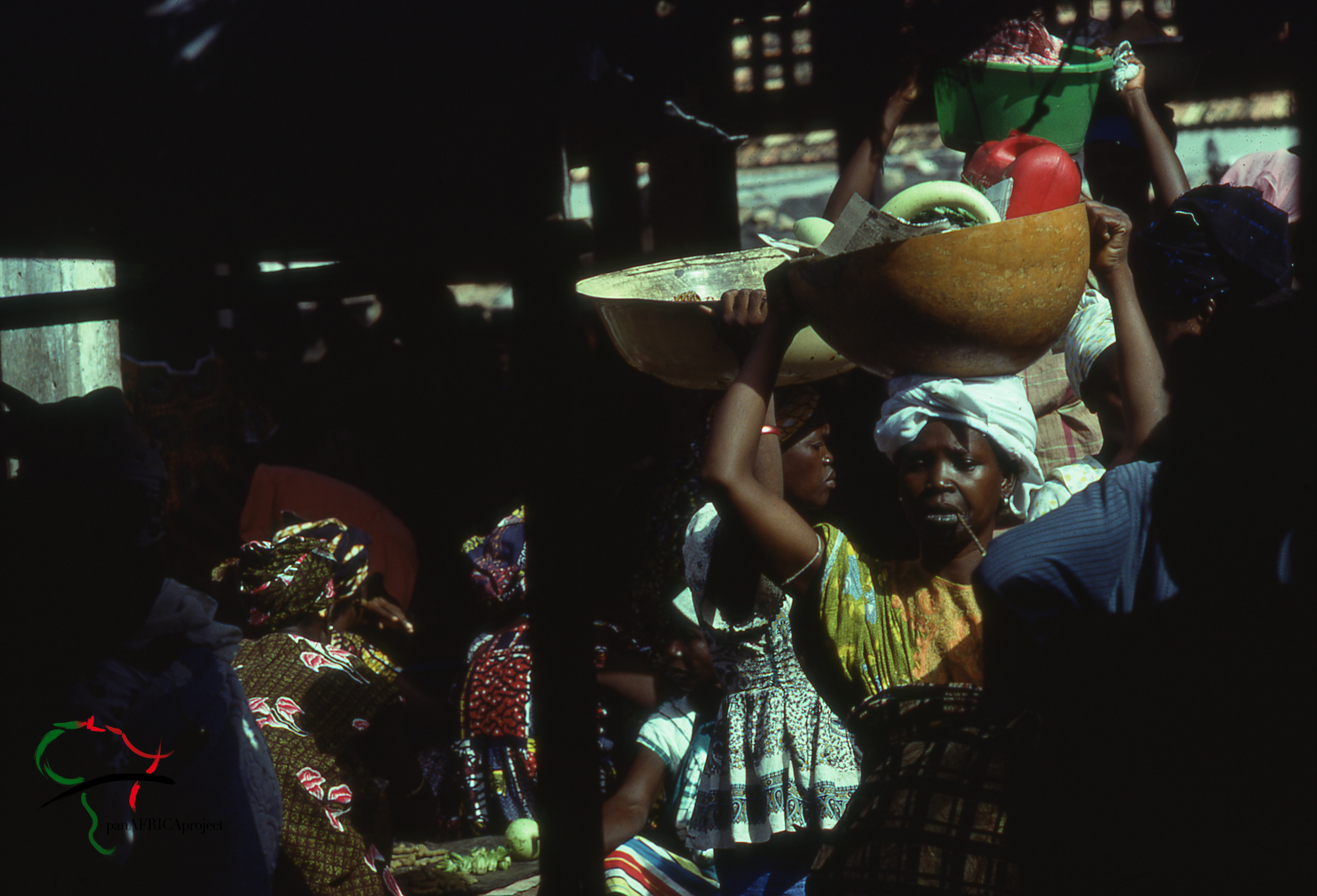 Women walking around a marketplace in Kaolack, Senegal