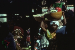 Women walking around a marketplace in Kaolack, Senegal