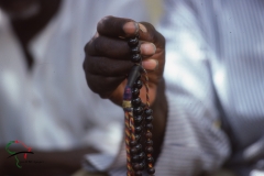 Person holding prayer beads in Touba, Senegal