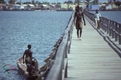 People walking on the bridge to Joal-Fadiouth, Senegal