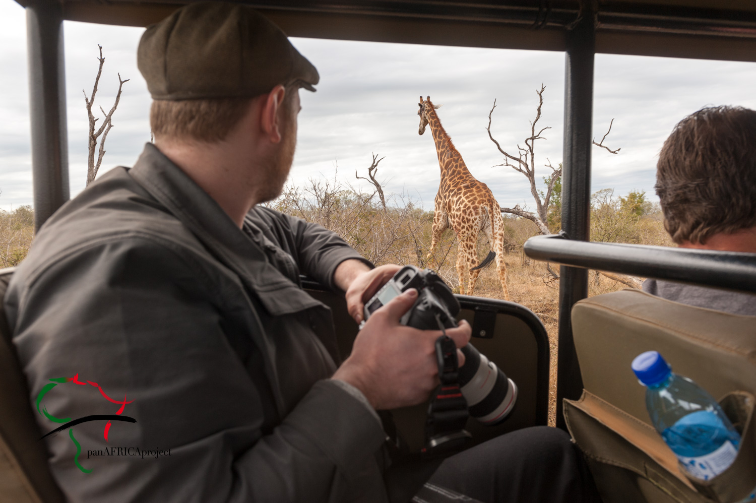 Photographer looking at a giraffe