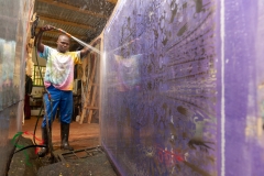 Artist washing a silk screen