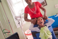 Child patient with cerebral palsy getting stretched out
