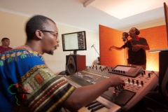 Hip hop musician recording a song in a studio