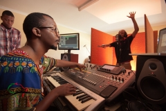 Hip hop musician recording a song in a studio