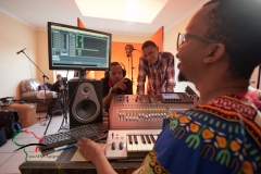 Hip hop musician recording a song in a studio