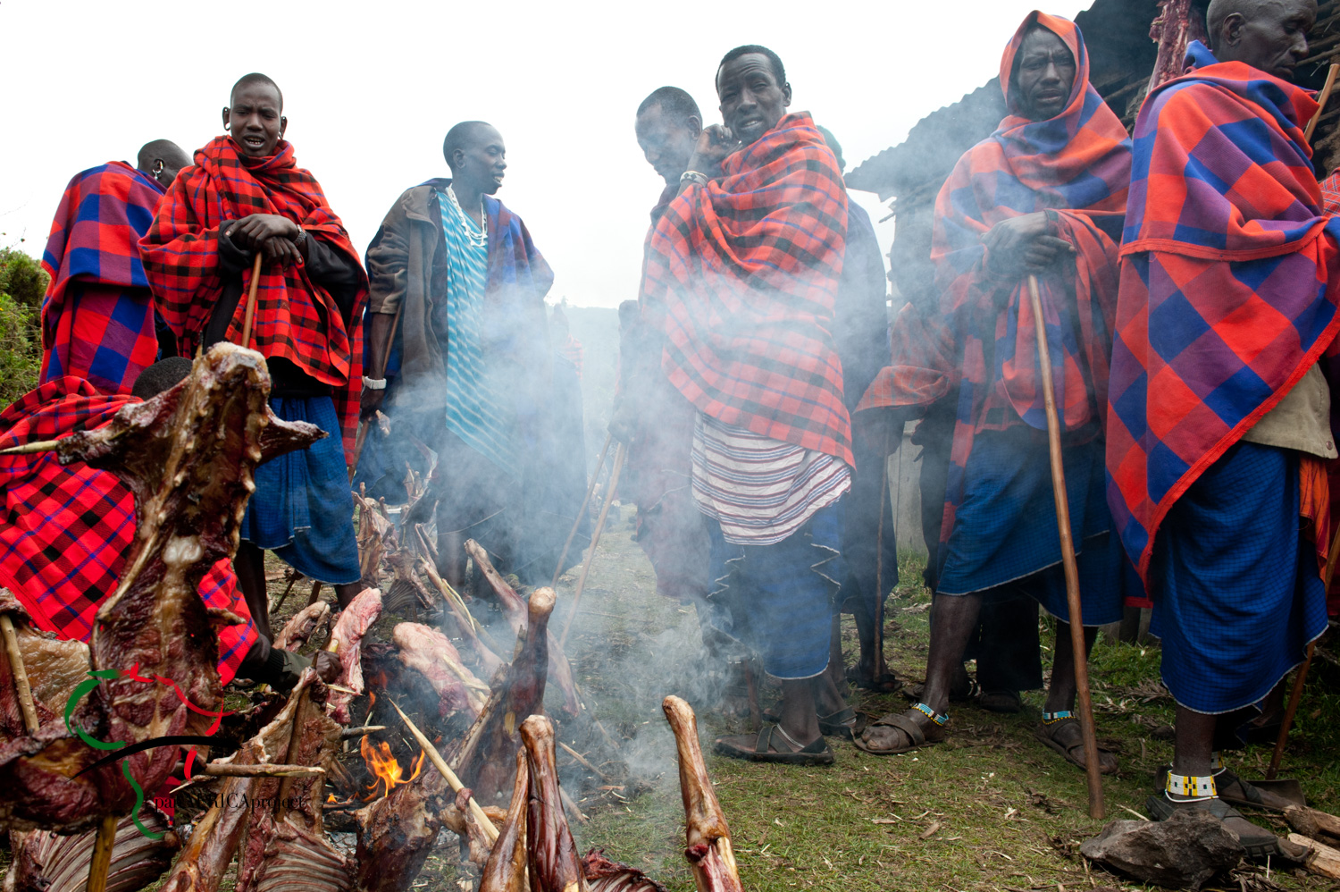 A group of Maasai people cooking meat