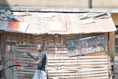 Man walking by a painting
