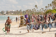 Inner tube retailer running on the beach