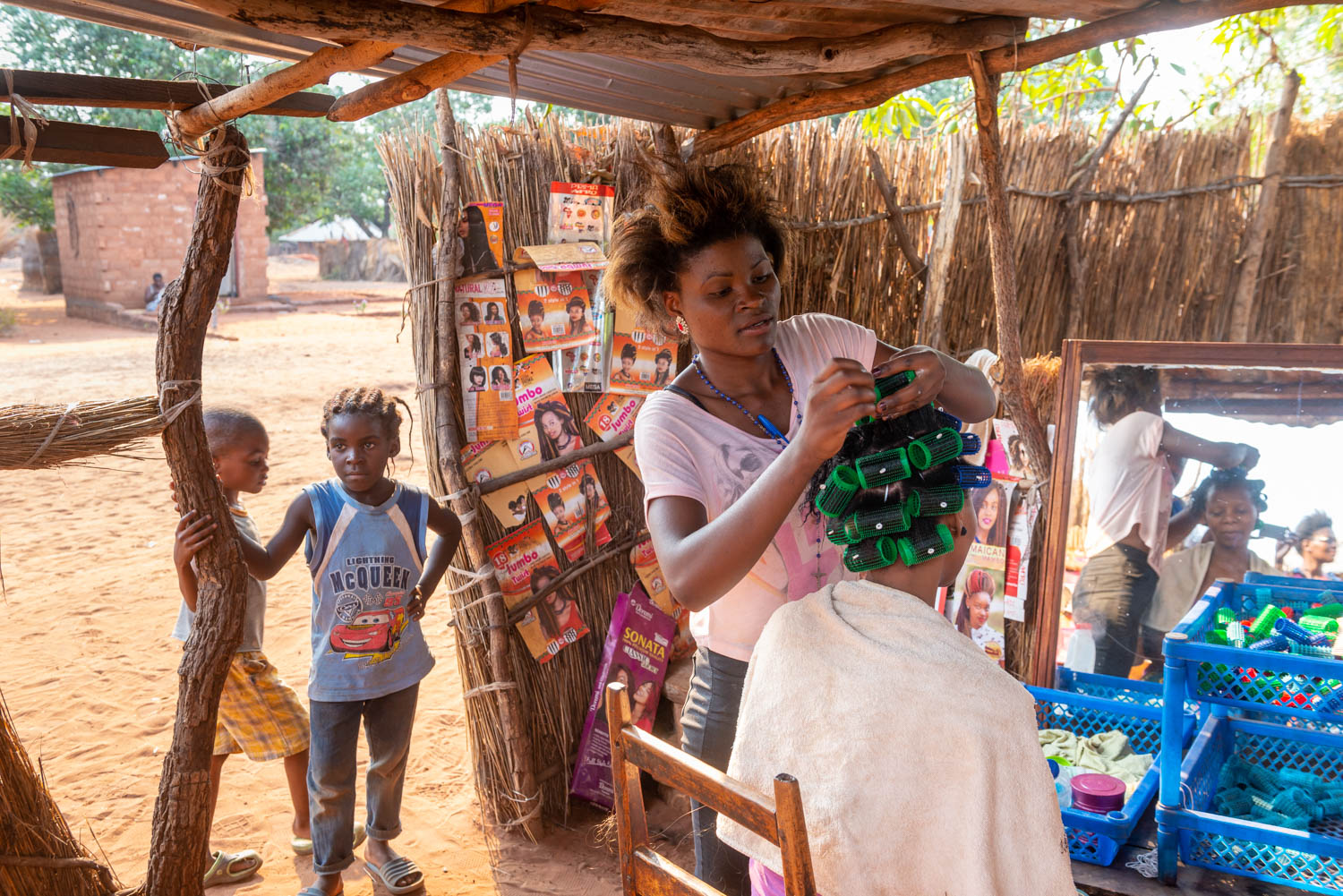 A Leya tribe hairdresser in Mukuni Village, Zambia