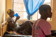 Patient with malaria laying in bed