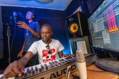 Musical producer in a studio with singer