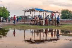 A group of people by a puddle