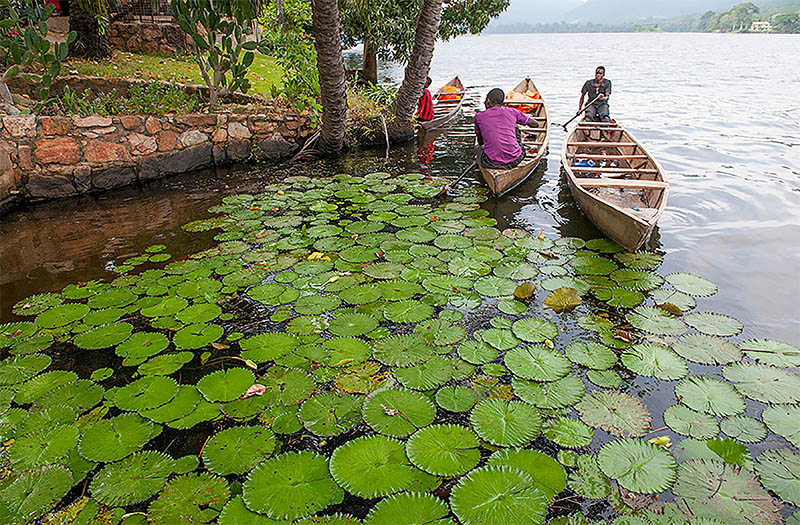 Men on canoes on Lake Volta