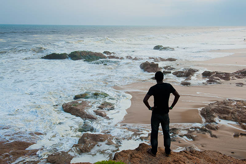 Man standing on a beach in Cape Coast