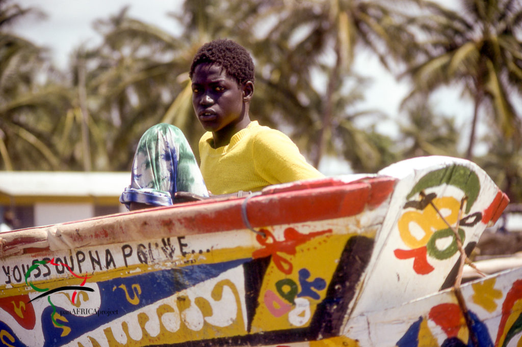 Man on a boat in a fishing village in Joal-Fadiouth