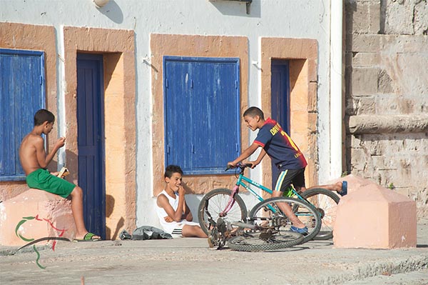 Children hanging out on bicycles in Essaouira