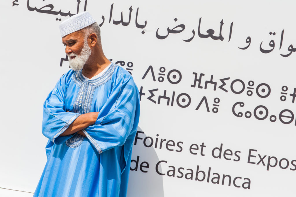 man and writing on wall in Morocco