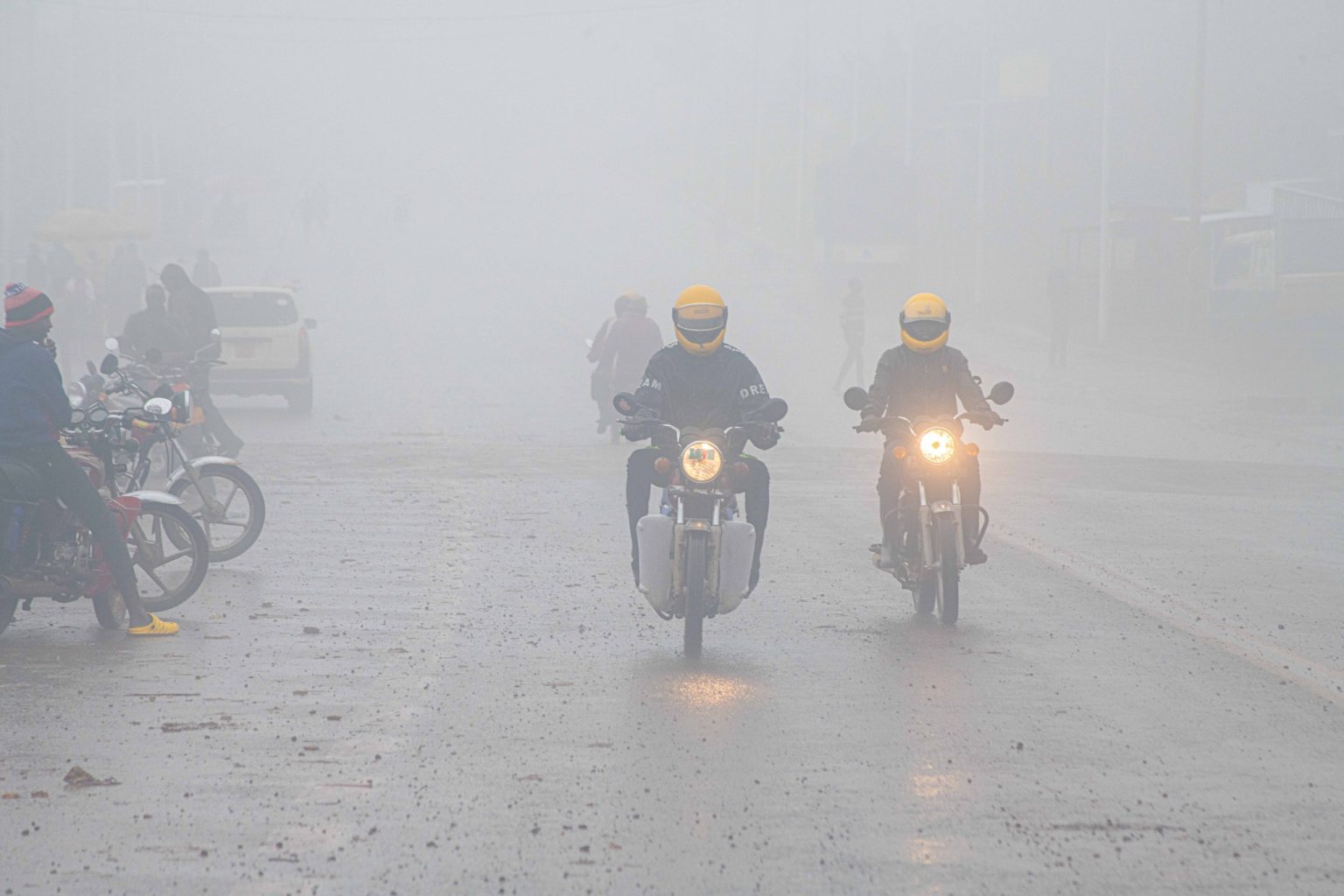 Uganda rain and motor bikes